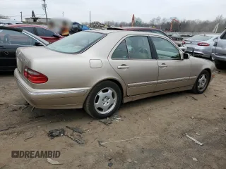 2002 Mercedes-Benz E-Class with VIN WDBJF82J52X062915, listed as a Copart auction lot 48284604 with 150,227 mi miles and Salvage Title. Bid and sale history available at carsss.com. Image 3.