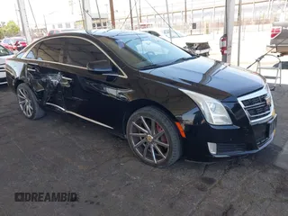 2013 Cadillac XTS Luxury with VIN 2G61P5S35D9105460, listed as a IAAI auction lot 42582313 with 144,895 mi miles and . Bid and sale history available at DreamBid. Image 1.