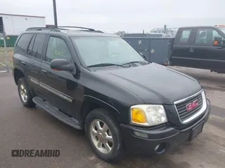 2002 GMC Envoy SLT with VIN 1GKDT13S222143135, listed as a IAAI auction lot 42136672 with 206,064 mi miles. Bid and sale history available at carsss.com. Image 1.