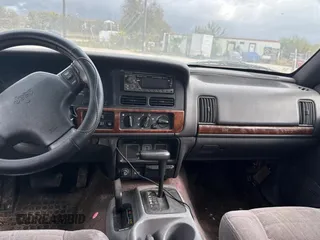1996 Jeep Grand Cherokee Laredo with VIN 1J4GZ58S9TC161645, listed as a Copart auction lot 85896144 with 0 mi miles and Clean Title. Bid and sale history available at carsss.com. Image 9.