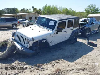 2015 Jeep Wrangler Unlimited Willys Wheeler with VIN 1C4BJWDG0FL546000, listed as a IAAI auction lot 41984566 with 112,742 mi miles and . Bid and sale history available at DreamBid. Image 2.