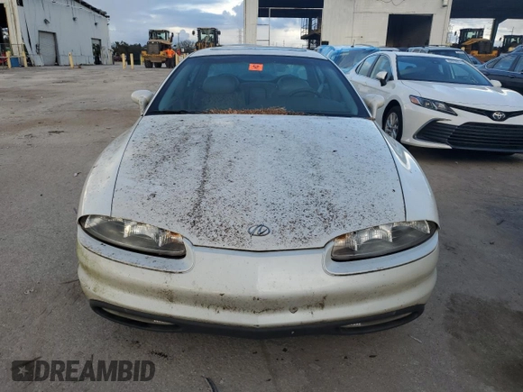 1999 Oldsmobile Aurora with VIN 1G3GR62C2X4107973, listed as a Copart auction lot 84023124 with 80,402 mi miles and Non Repairable. Bid and sale history available at DreamBid. Image 5.