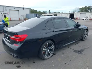 2019 BMW 7 Series 740i with VIN WBA7E2C57KB217973, listed as a IAAI auction lot 39064321 with 54,818 mi miles and . Bid and sale history available at DreamBid. Image 4.