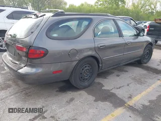 2003 Ford Taurus SE Standard with VIN 1FAFP58U63G117125, listed as a IAAI auction lot 42061812 with 172,154 mi miles. Bid and sale history available at carsss.com. Image 4.