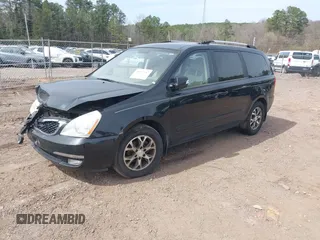 2014 Kia Sedona LX with VIN KNDMG4C7XE6586613, listed as a IAAI auction lot 41597187 with 211,851 mi miles. Bid and sale history available at carsss.com. Image 2.