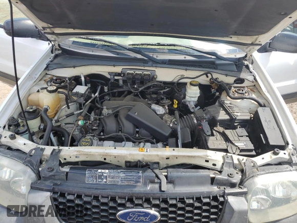 2005 Ford Escape XLT z VIN 1FMYU93145DA04306, wystawiony jako Copart lot #56209425 z przebiegiem 124 956 mil mil oraz Szkoda całkowita • Salvage title. Historia ofert i sprzedaży dostępna na DreamBid. Obrazek 12.