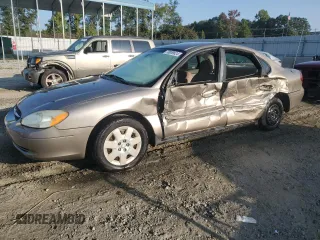 2003 Ford Taurus z VIN 1FAFP52253A170456, wystawiony jako Copart lot #70009824 z przebiegiem 216 567 mil mil oraz Szkody całkowita. Historia ofert i sprzedaży dostępna na DreamBid. Obrazek 1.