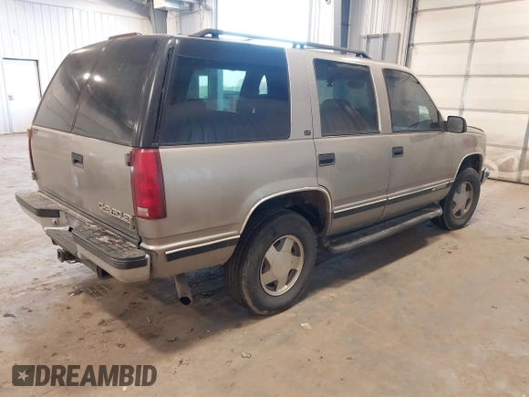 1999 Chevrolet Tahoe Z71 with VIN 1GNEK13R7XJ577796, listed as a IAAI auction lot 41036617 with 231,795 mi miles and . Bid and sale history available at DreamBid. Image 4.