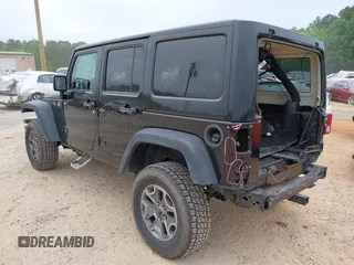 2015 Jeep Wrangler Unlimited Rubicon with VIN 1C4BJWFG7FL688728, listed as a IAAI auction lot 42054304 with 100,152 mi miles and . Bid and sale history available at DreamBid. Image 3.