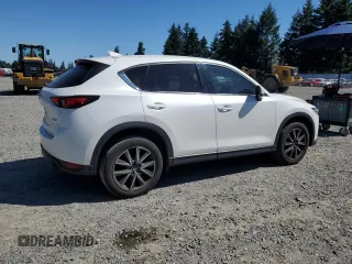 2018 Mazda CX-5 Grand Touring with VIN JM3KFBDM0J0419989, listed as a Copart auction lot 62868005 with 120,217 mi miles and Salvage title. Bid and sale history available at DreamBid. Image 3.