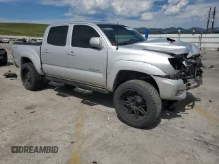 2012 Toyota Tacoma with VIN 5TFLU4ENXCX027960, listed as a Copart auction lot 60689025 with 209,480 mi miles and Salvage title. Bid and sale history available at DreamBid. Image 4.
