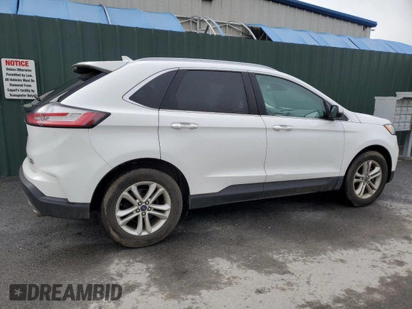 2020 Ford Edge SEL z VIN 2FMPK3J90LBB01559, wystawiony jako Copart lot #61365305 z przebiegiem 120 050 mil mil oraz Czysty tytuł • Clean title. Historia ofert i sprzedaży dostępna na DreamBid. Obrazek 3.