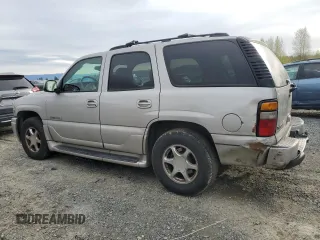 2005 GMC Yukon Denali z VIN 1GKEK63U65J262371, wystawiony jako Copart lot #52773425 z przebiegiem 129 028 mil mil oraz Czysty tytuł • Clean title. Historia ofert i sprzedaży dostępna na DreamBid. Obrazek 2.