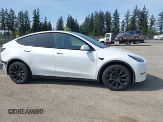 2023 Tesla Model Y Long Range with VIN 7SAYGDEE4PF676167, listed as a IAAI auction lot 42147909 with 20,488 mi miles. Bid and sale history available at carsss.com. Image 14.