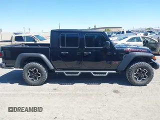 2023 Jeep Gladiator Rubicon z VIN 1C6JJTBG3PL531982, wystawiony jako IAAI lot #42211139 z przebiegiem 28 301 mil mil oraz . Historia ofert i sprzedaży dostępna na DreamBid. Obrazek 13.