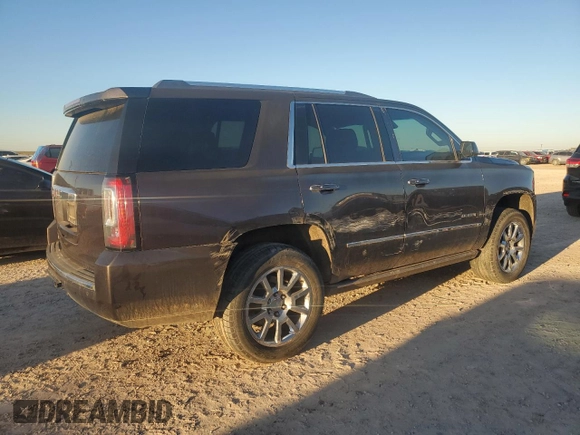 2015 GMC Yukon Denali with VIN 1GKS1CKJ7FR132677, listed as a Copart auction lot 82118584 with 144,798 mi miles and Salvage Title. Bid and sale history available at carsss.com. Image 3.