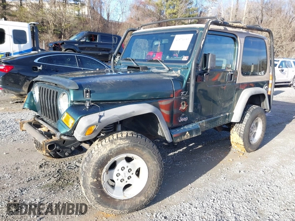 2000 Jeep Wrangler Sahara with VIN 1J4FA59S0YP724521, listed as a IAAI auction lot 41574689 with 167,584 mi miles. Bid and sale history available at carsss.com. Image 17.
