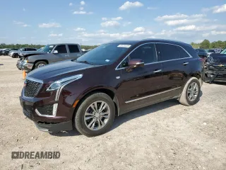 2021 Cadillac XT5 FWD Premium Luxury with VIN 1GYKNCRS2MZ180884, listed as a Copart auction lot 50433445 with 27,246 mi miles and Salvage Title. Bid and sale history available at carsss.com. Image 1.