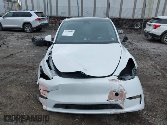 2022 Tesla Model Y Long Range with VIN 7SAYGAEE4NF516625, listed as a IAAI auction lot 41892225 with 33,054 mi miles and . Bid and sale history available at DreamBid. Image 12.