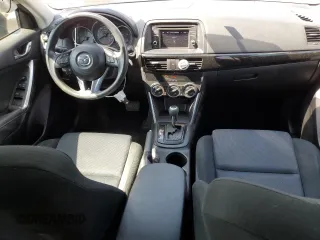 2014 Mazda CX-5 Sport with VIN JM3KE2BE7E0334880, listed as a Copart auction lot 61780635 with 96,926 mi miles and Salvage title. Bid and sale history available at DreamBid. Image 8.