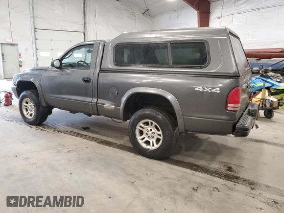 2003 Dodge Dakota z VIN 1D7GG16X23S204317, wystawiony jako Copart lot #54830745 z przebiegiem 139 508 mil mil oraz Szkoda całkowita • Salvage title. Historia ofert i sprzedaży dostępna na DreamBid. Obrazek 2.