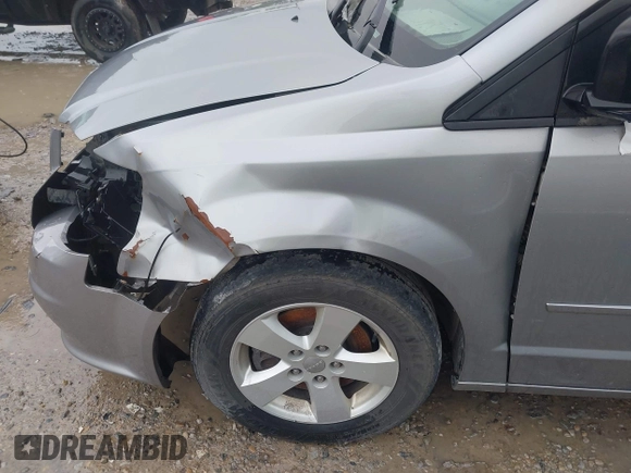 2013 Dodge Grand Caravan SE with VIN 2C4RDGBG2DR773577, listed as a IAAI auction lot 41823951 with 226,498 mi miles and . Bid and sale history available at DreamBid. Image 12.