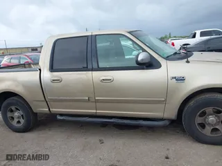 2001 Ford F-150 SuperCrew XLT with VIN 1FTRW07W61KE35305, listed as a IAAI auction lot 41912087 with 221,826 mi miles. Bid and sale history available at carsss.com. Image 13.