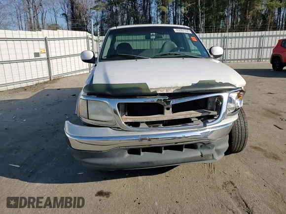 2000 Ford F-150 XL with VIN 1FTRX17L1YNA26050, listed as a Copart auction lot 43597105 with 205,152 mi miles and Salvage Title. Bid and sale history available at carsss.com. Image 11.