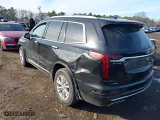 2023 Cadillac XT6 Luxury with VIN 1GYKPBR41PZ136918, listed as a IAAI auction lot 41417724 with 57,949 mi miles. Bid and sale history available at carsss.com. Image 6.