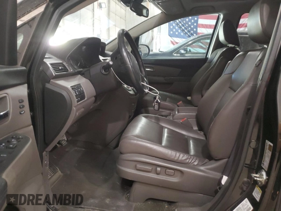 2014 Honda Odyssey Touring z VIN 5FNRL5H91EB128917, wystawiony jako Copart lot #49353085 z przebiegiem 208 871 mil mil oraz Czysty tytuł • Clean title. Historia ofert i sprzedaży dostępna na DreamBid. Obrazek 7.