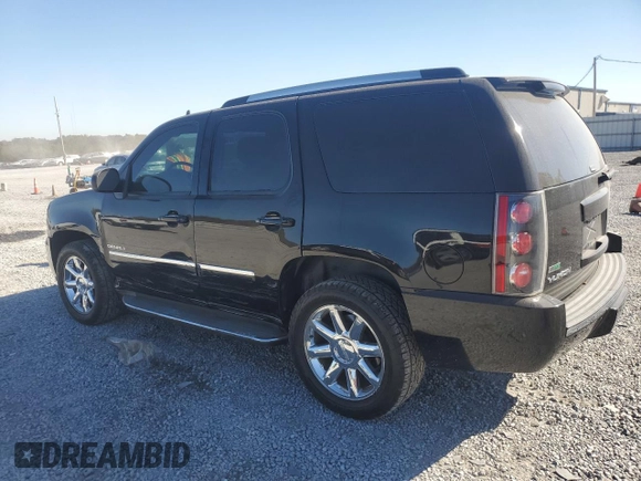 2011 GMC Yukon Denali with VIN 1GKS1EEFXBR121055, listed as a Copart auction lot 77194354 with 98,806 mi miles and Salvage Title. Bid and sale history available at carsss.com. Image 2.