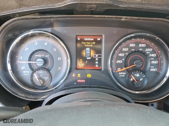 2012 Dodge Charger SRT8 with VIN 2C3CDXEJ4CH228471, listed as a Copart auction lot 82397844 with 125,437 mi miles and Salvage Title. Bid and sale history available at carsss.com. Image 9.