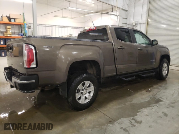 2015 GMC Canyon 4WD SLE z VIN 1GTG6BE3XF1242163, wystawiony jako Copart lot #57132035 z przebiegiem 110 241 mil mil oraz Szkoda całkowita • Salvage title. Historia ofert i sprzedaży dostępna na DreamBid. Obrazek 3.