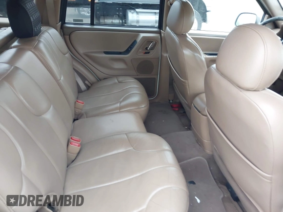 2000 Jeep Grand Cherokee Laredo z VIN 1J4GW48S2YC390226, wystawiony jako IAAI lot #42326715 z przebiegiem 273 806 mil mil oraz . Historia ofert i sprzedaży dostępna na DreamBid. Obrazek 8.