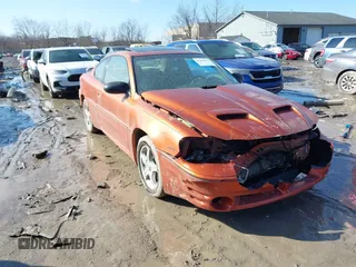 2004 Pontiac Grand Am GT with VIN 1G2NW12E94C157702, listed as a IAAI auction lot 41642443 with 189,176 mi miles. Bid and sale history available at carsss.com. Image 1.