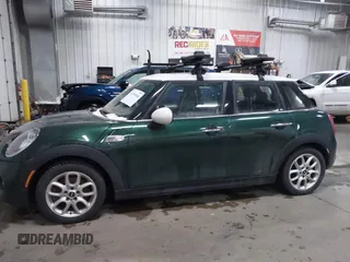 2015 MINI Hardtop 4 Door S z VIN WMWXU3C55FT892293, wystawiony jako IAAI lot #41359066 z przebiegiem 112 704 mil mil oraz . Historia ofert i sprzedaży dostępna na DreamBid. Obrazek 14.