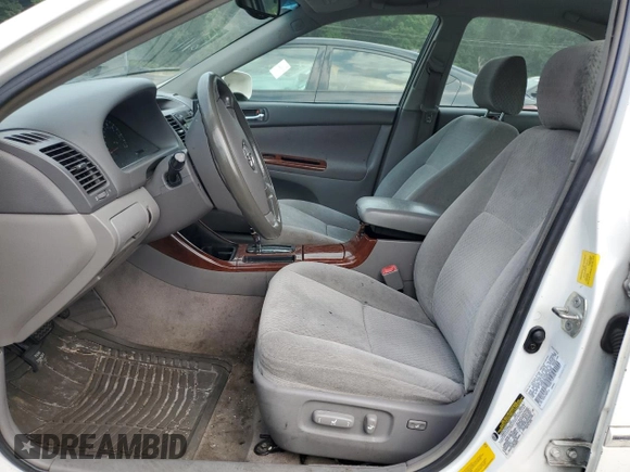 2004 Toyota Camry LE z VIN 4T1BE30K04U301360, wystawiony jako Copart lot #60804115 z przebiegiem 287 009 mil mil oraz Szkoda całkowita • Salvage title. Historia ofert i sprzedaży dostępna na DreamBid. Obrazek 7.
