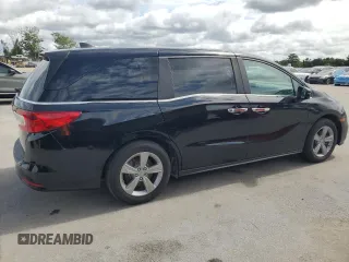 2018 Honda Odyssey EX-L z VIN 5FNRL6H7XJB031245, wystawiony jako Copart lot #59331635 z przebiegiem 74 901 mil mil oraz Czysty tytuł • Clean title. Historia ofert i sprzedaży dostępna na DreamBid. Obrazek 3.