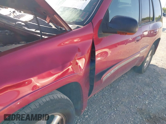 2004 GMC Envoy SLT with VIN 1GKDT13S342150579, listed as a IAAI auction lot 42055124 with 233,090 mi miles and . Bid and sale history available at DreamBid. Image 6.