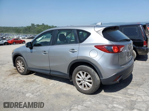 2014 Mazda CX-5 Sport with VIN JM3KE2BE7E0334880, listed as a Copart auction lot 61780635 with 96,926 mi miles and Salvage title. Bid and sale history available at DreamBid. Image 2.