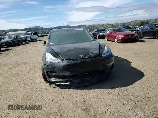 2019 Tesla Model 3 Mid Range with VIN 5YJ3E1EAXKF311719, listed as a Copart auction lot 44570825 with 143,034 mi miles and Salvage Title. Bid and sale history available at carsss.com. Image 11.