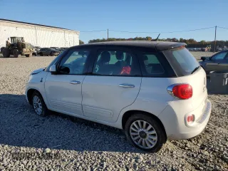 2014 FIAT 500L Easy z VIN ZFBCFABH4EZ023856, wystawiony jako Copart lot #76285024 z przebiegiem 131 343 mil mil oraz Szkoda całkowita • Salvage title. Historia ofert i sprzedaży dostępna na DreamBid. Obrazek 2.