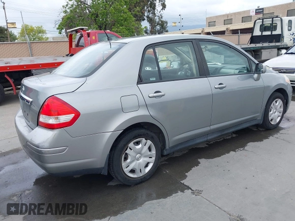 2011 Nissan Versa 1.8 S with VIN 3N1BC1AP0BL461824, listed as a IAAI auction lot 42076994 with 180,798 mi miles. Bid and sale history available at carsss.com. Image 4.