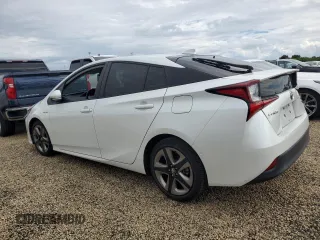 2021 Toyota Prius L Eco с VIN JTDKAMFU5M3142128, выставлен на аукционе Copart как лот 73832324 с пробегом 21 460 миль миль и Списание • Salvage title. История ставок и продаж доступна на DreamBid. Изображение 2.