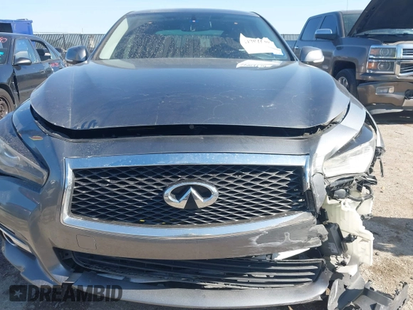 2014 Infiniti Q50 Hybrid Premium with VIN JN1AV7AP4EM691014, listed as a IAAI auction lot 41984130 with 114,230 mi miles and . Bid and sale history available at DreamBid. Image 12.