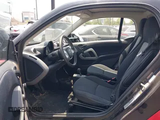 2014 Smart fortwo Pure z VIN WMEEJ3BAXEK744079, wystawiony jako IAAI lot #42421069 z przebiegiem 79 788 mil mil oraz . Historia ofert i sprzedaży dostępna na DreamBid. Obrazek 5.