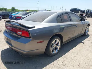 2012 Dodge Charger SE with VIN 2C3CDXBG5CH219805, listed as a IAAI auction lot 42002071 with 238,820 mi miles. Bid and sale history available at carsss.com. Image 4.