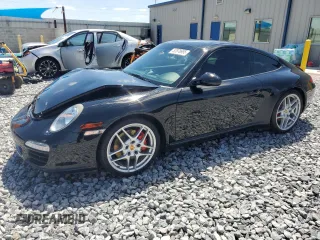 2009 Porsche 911 Carrera S z VIN WP0AB29989S720935, wystawiony jako Copart lot #52878995 z przebiegiem 76 856 mil mil oraz Szkoda całkowita • Salvage title. Historia ofert i sprzedaży dostępna na DreamBid. Obrazek 1.