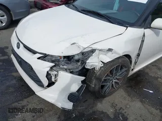 2014 Scion tC z VIN JTKJF5C77E3082073, wystawiony jako IAAI lot #42107615 z przebiegiem 223 895 mil mil oraz . Historia ofert i sprzedaży dostępna na DreamBid. Obrazek 6.
