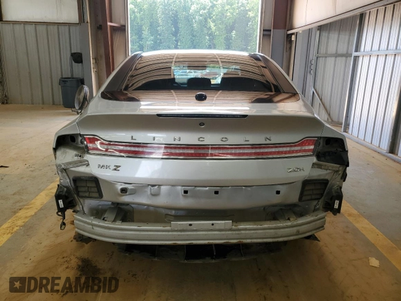 2015 Lincoln MKZ Hybrid z VIN 3LN6L2LU1FR606066, wystawiony jako Copart lot #61955415 z przebiegiem 127 214 mil mil oraz Szkoda całkowita • Salvage title. Historia ofert i sprzedaży dostępna na DreamBid. Obrazek 6.